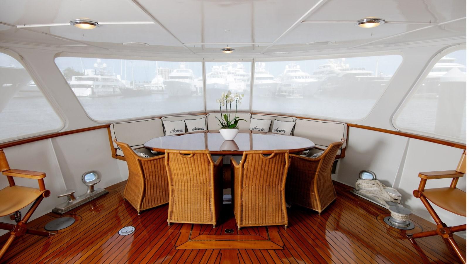 a dining table in a room aboard AVANTE V Yacht for Sale