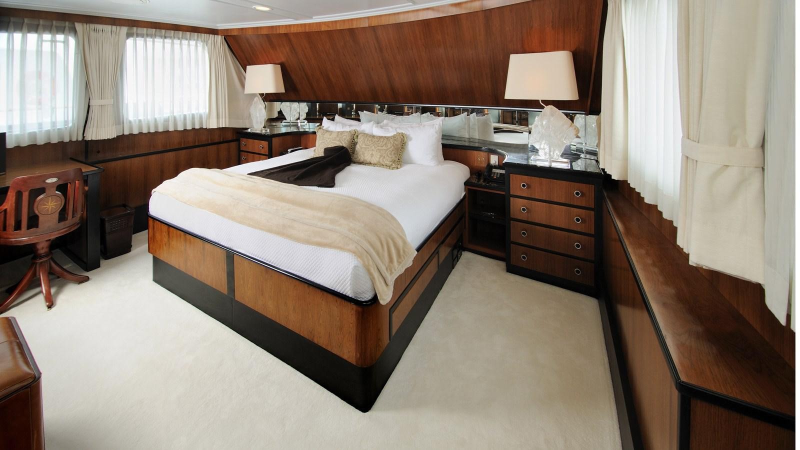 a room with a bed and a desk aboard AVANTE V Yacht for Sale