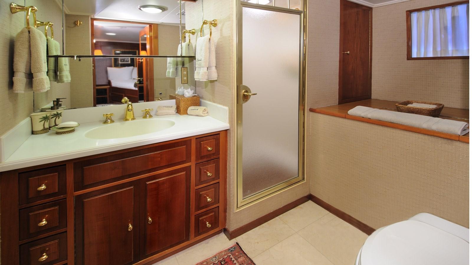 a bathroom with a large mirror aboard AVANTE V Yacht for Sale