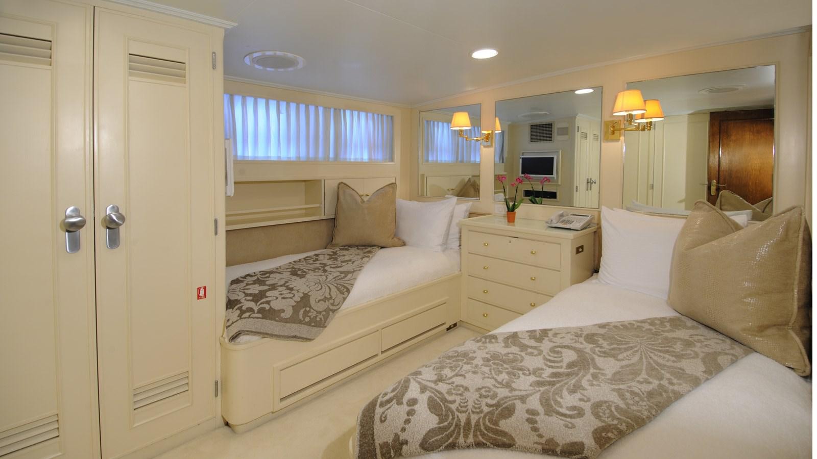 a couple of beds in a hotel room aboard AVANTE V Yacht for Sale