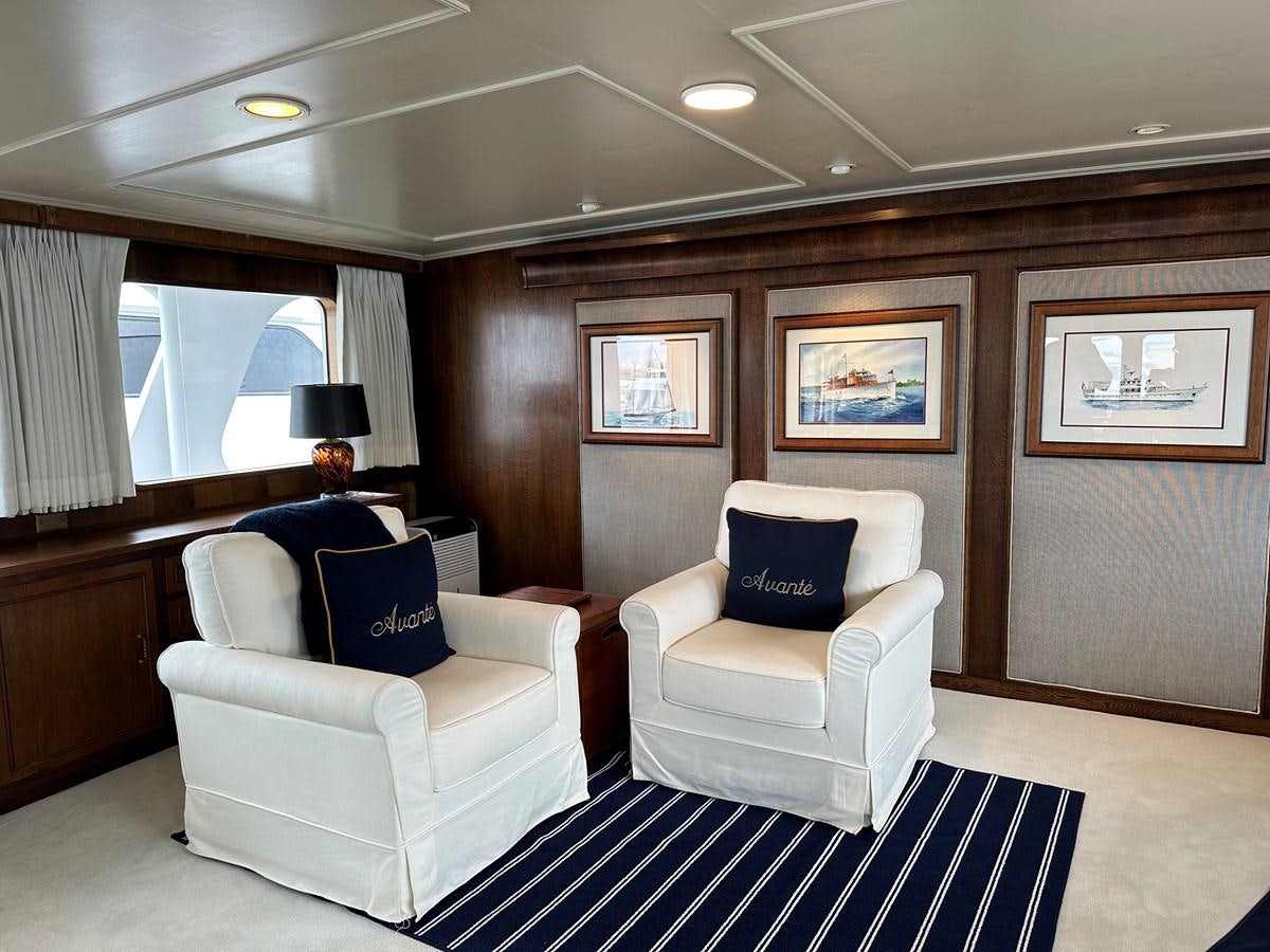 a room with a couch and a chair aboard AVANTE V Yacht for Sale