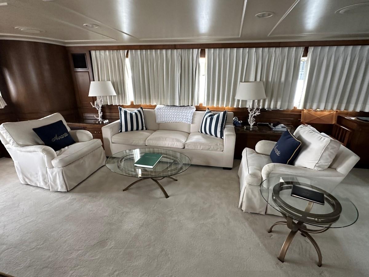 a living room with couches and a coffee table aboard AVANTE V Yacht for Sale