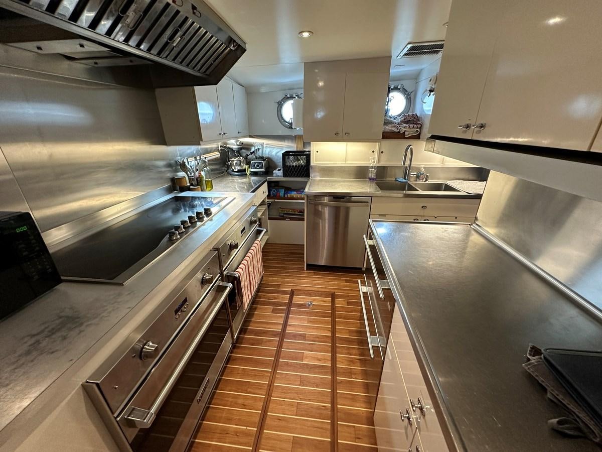 a kitchen with stainless steel appliances aboard AVANTE V Yacht for Sale