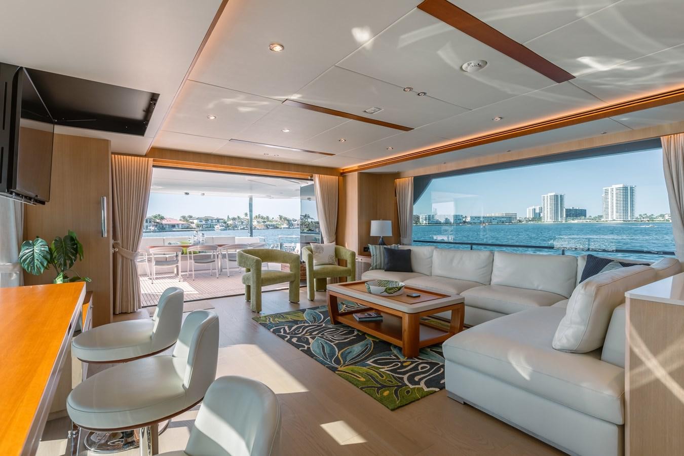 a living room with a large window aboard ONE MORE TIME Yacht for Sale