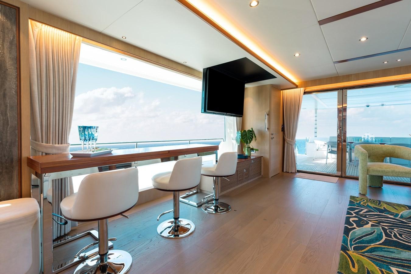 a room with a table and chairs aboard ONE MORE TIME Yacht for Sale