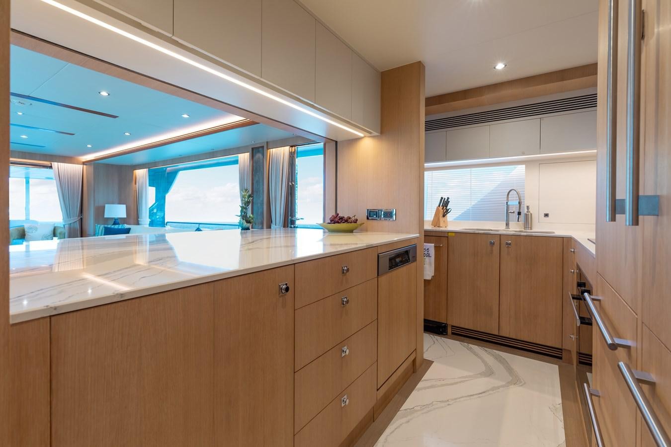 a kitchen with a large window aboard ONE MORE TIME Yacht for Sale