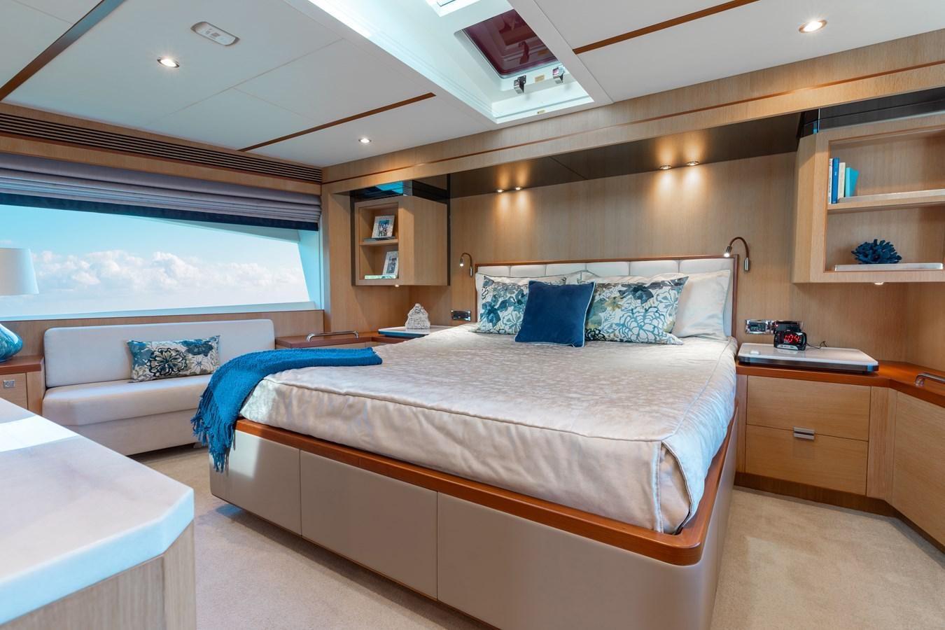 a room with a bed and a desk aboard ONE MORE TIME Yacht for Sale