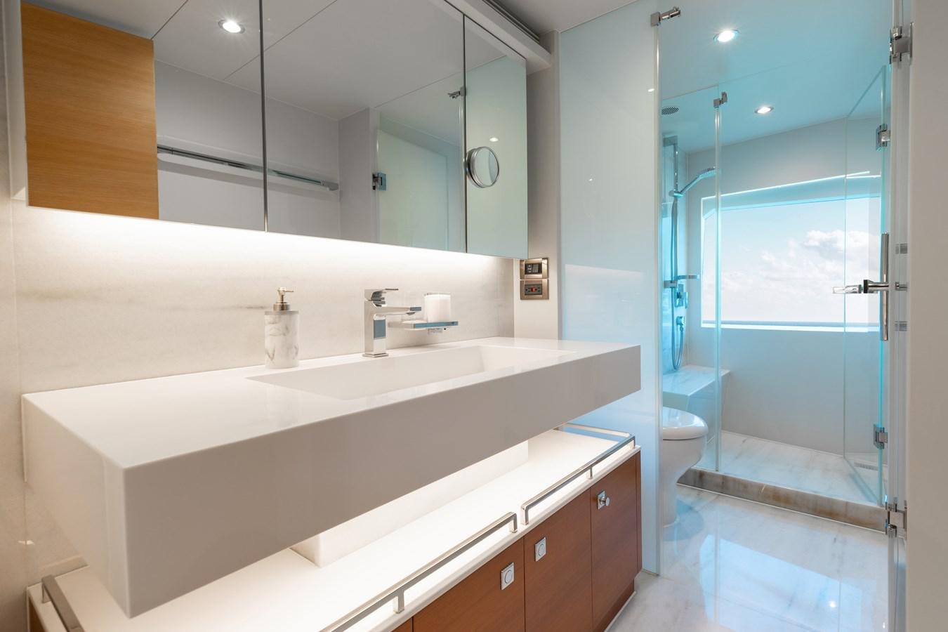a bathroom with a large mirror aboard ONE MORE TIME Yacht for Sale