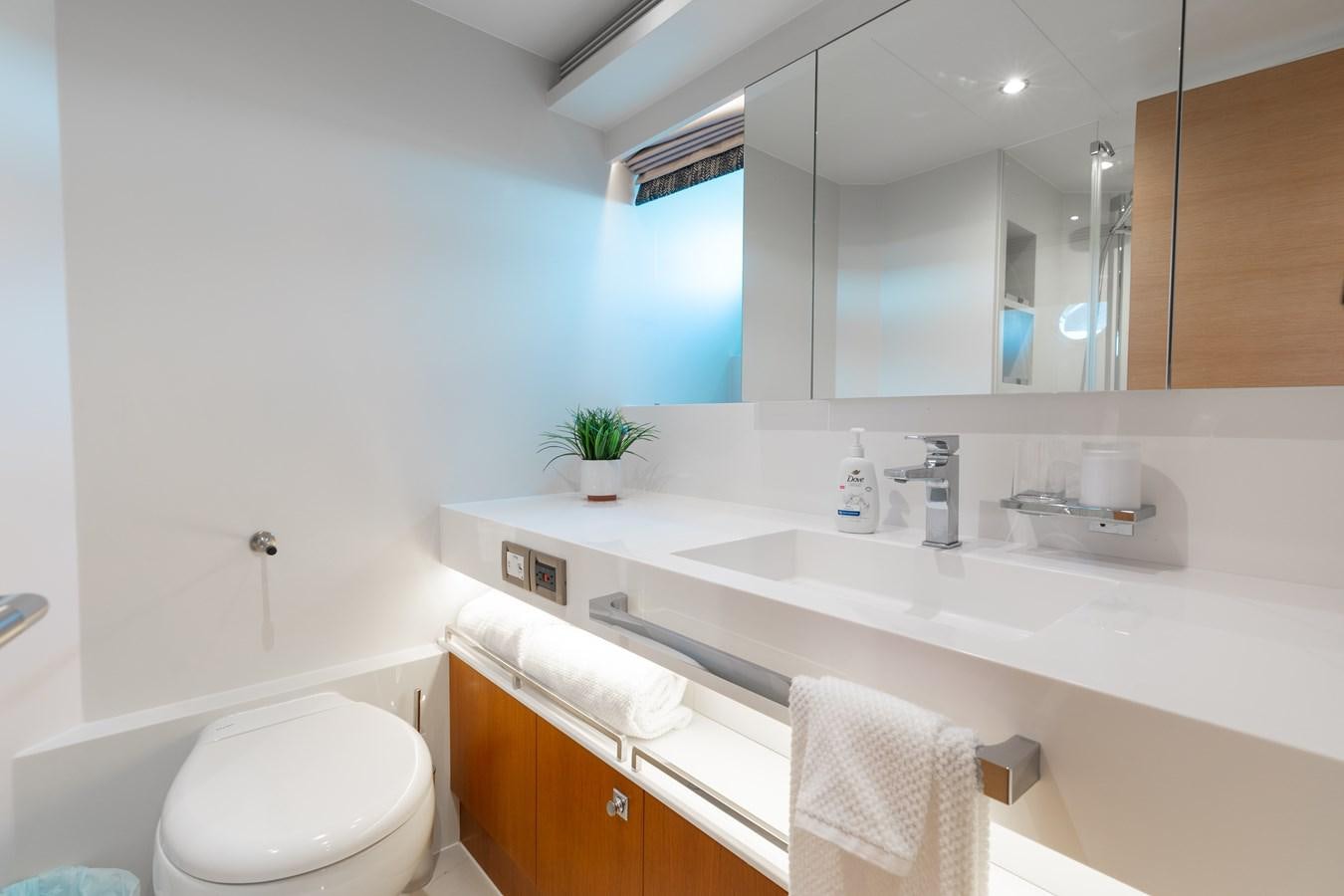 a bathroom with a large mirror aboard ONE MORE TIME Yacht for Sale