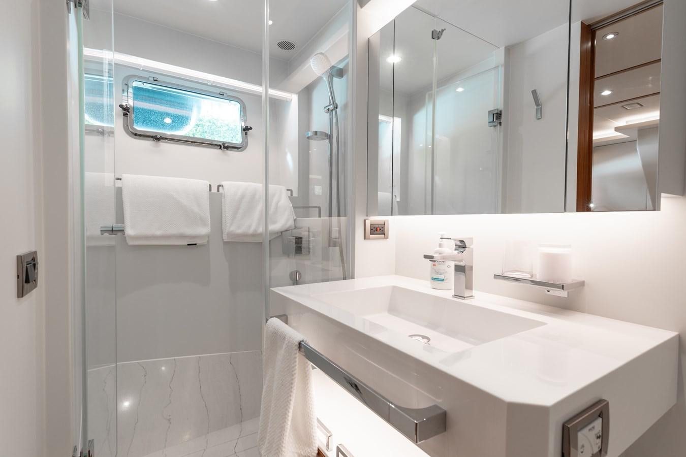 a bathroom with a large mirror aboard ONE MORE TIME Yacht for Sale