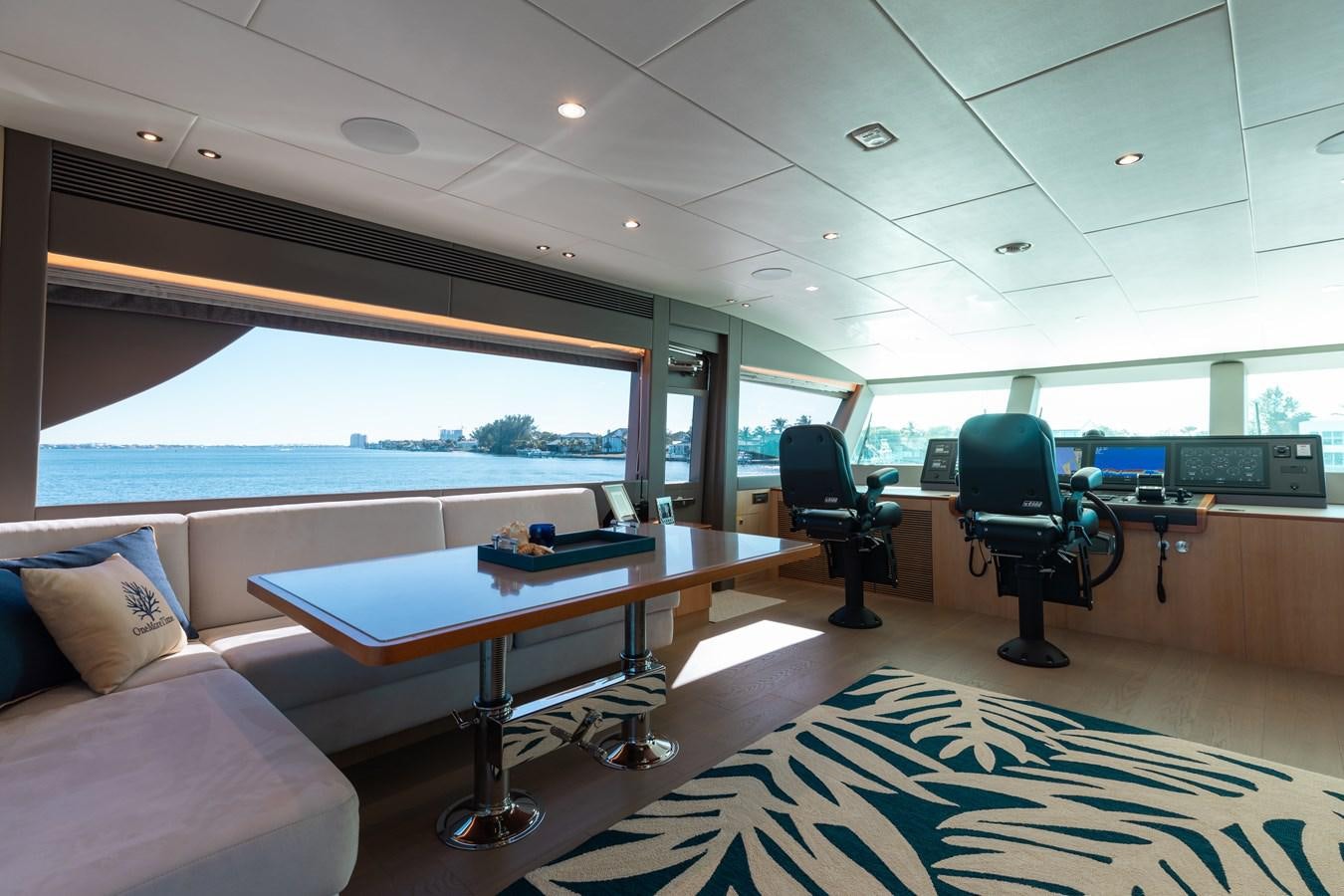 a room with a table and chairs aboard ONE MORE TIME Yacht for Sale