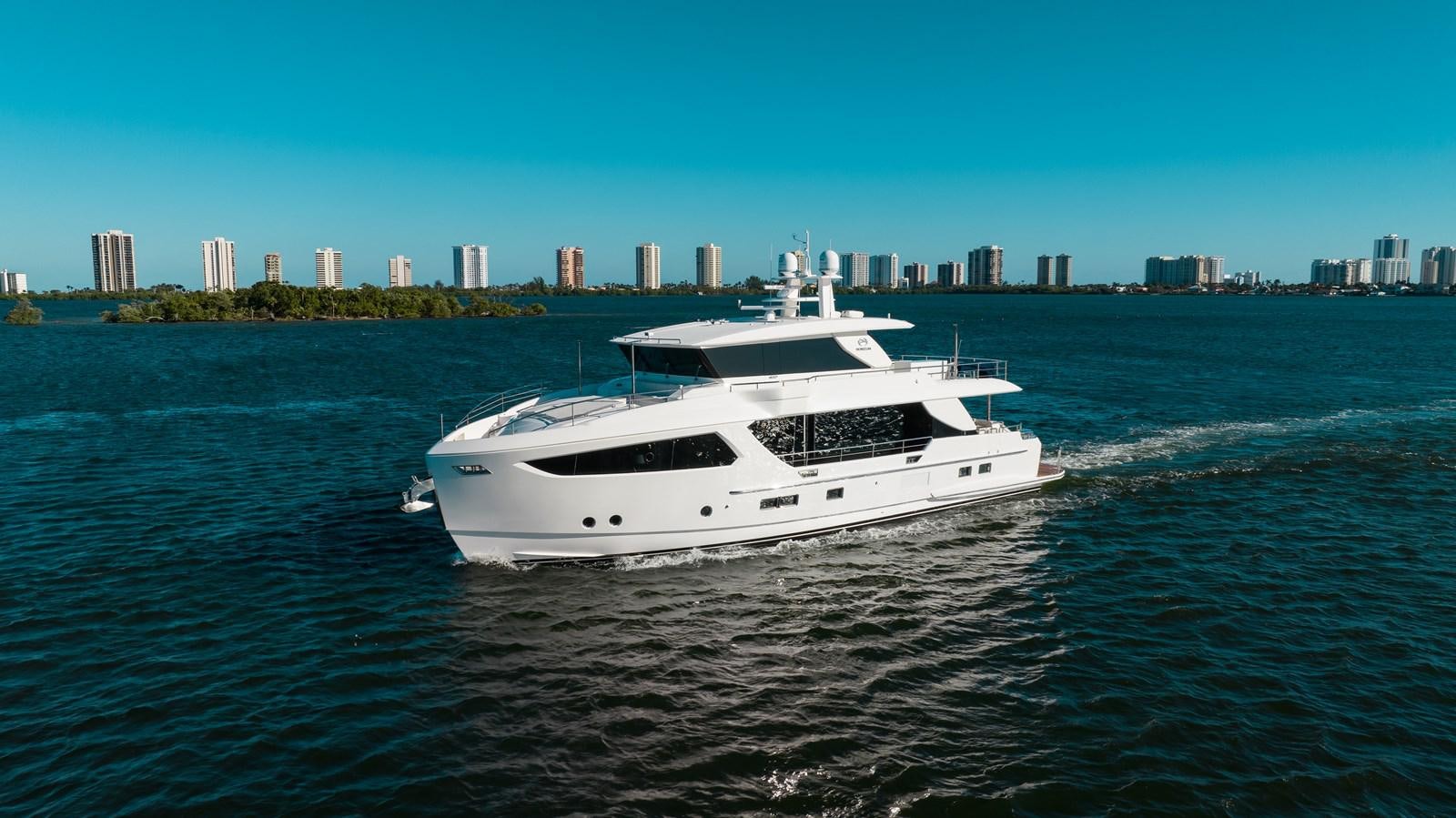 a white yacht on the water aboard ONE MORE TIME Yacht for Sale