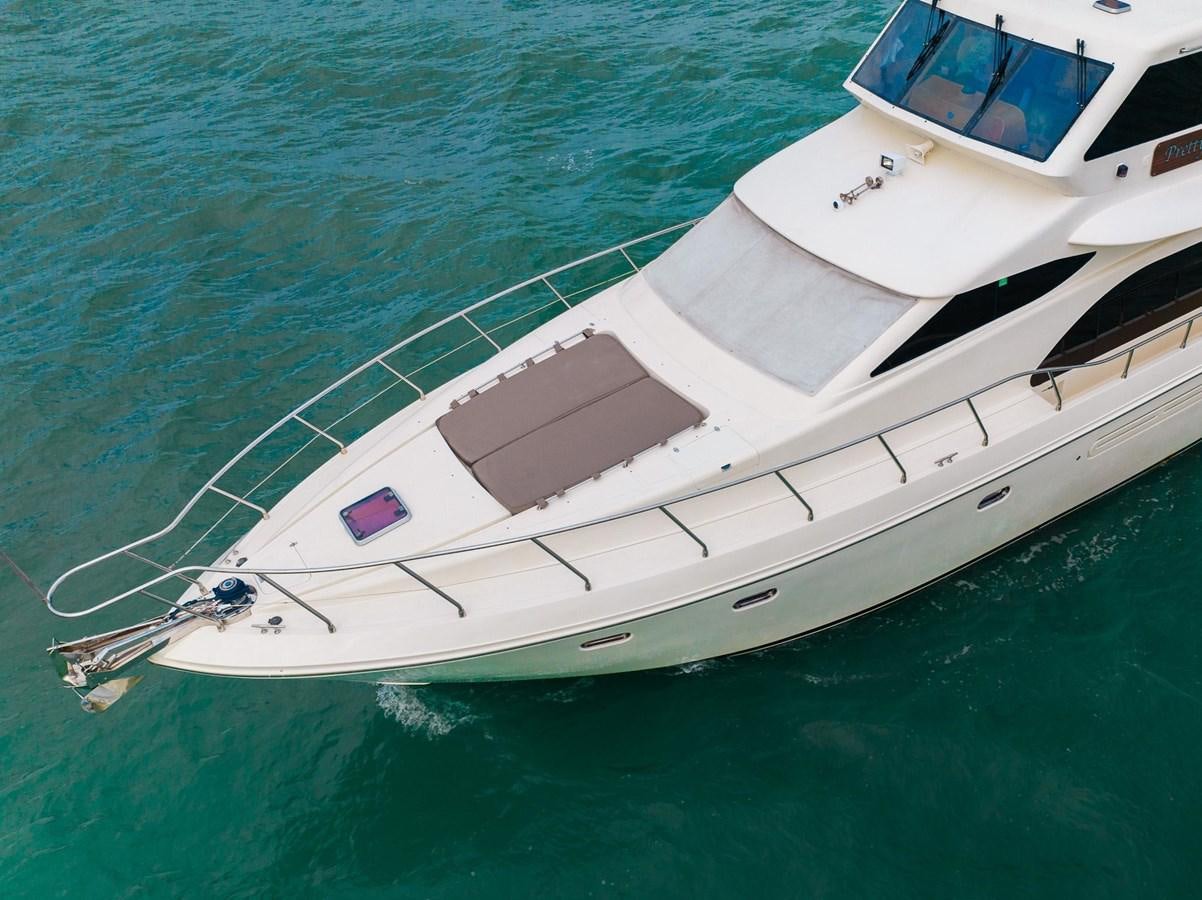 a white boat in the water aboard PRETTY PENNY Yacht for Sale