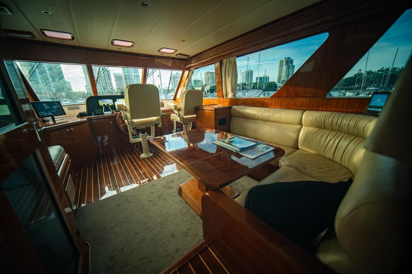 a train with a couch and coffee table aboard PRETTY PENNY Yacht for Sale