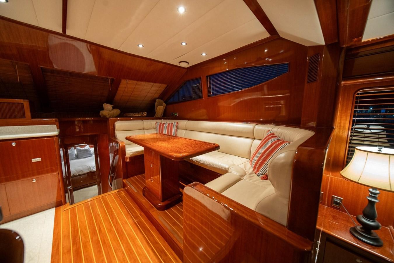 a room with a couch and a table aboard PRETTY PENNY Yacht for Sale