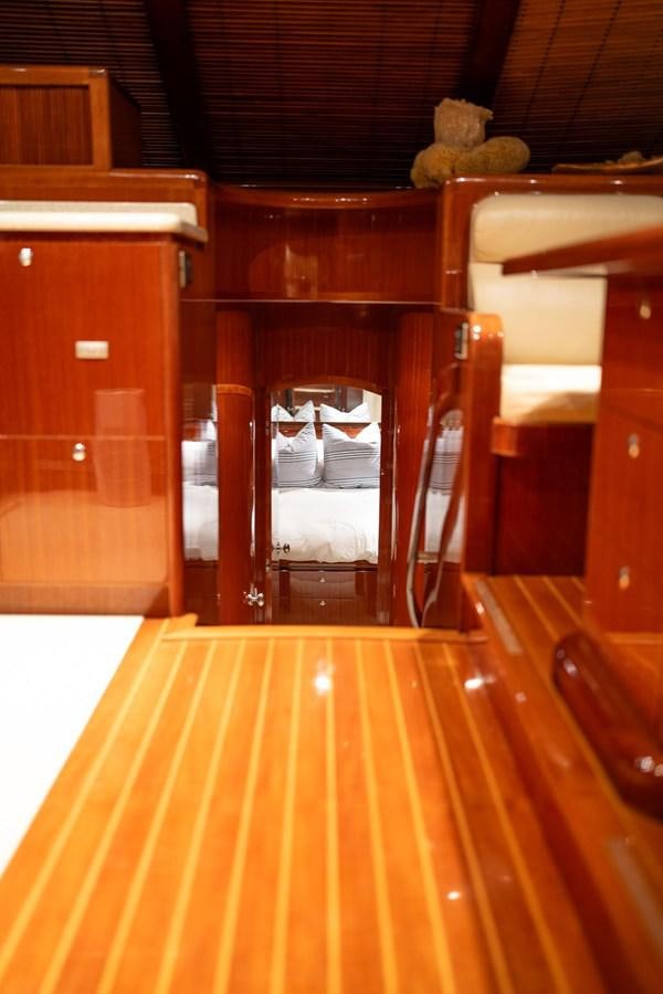 a teddy bear sits on a chair aboard PRETTY PENNY Yacht for Sale