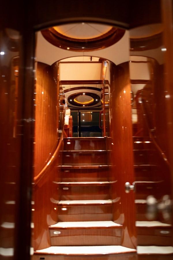 a large wooden staircase aboard PRETTY PENNY Yacht for Sale