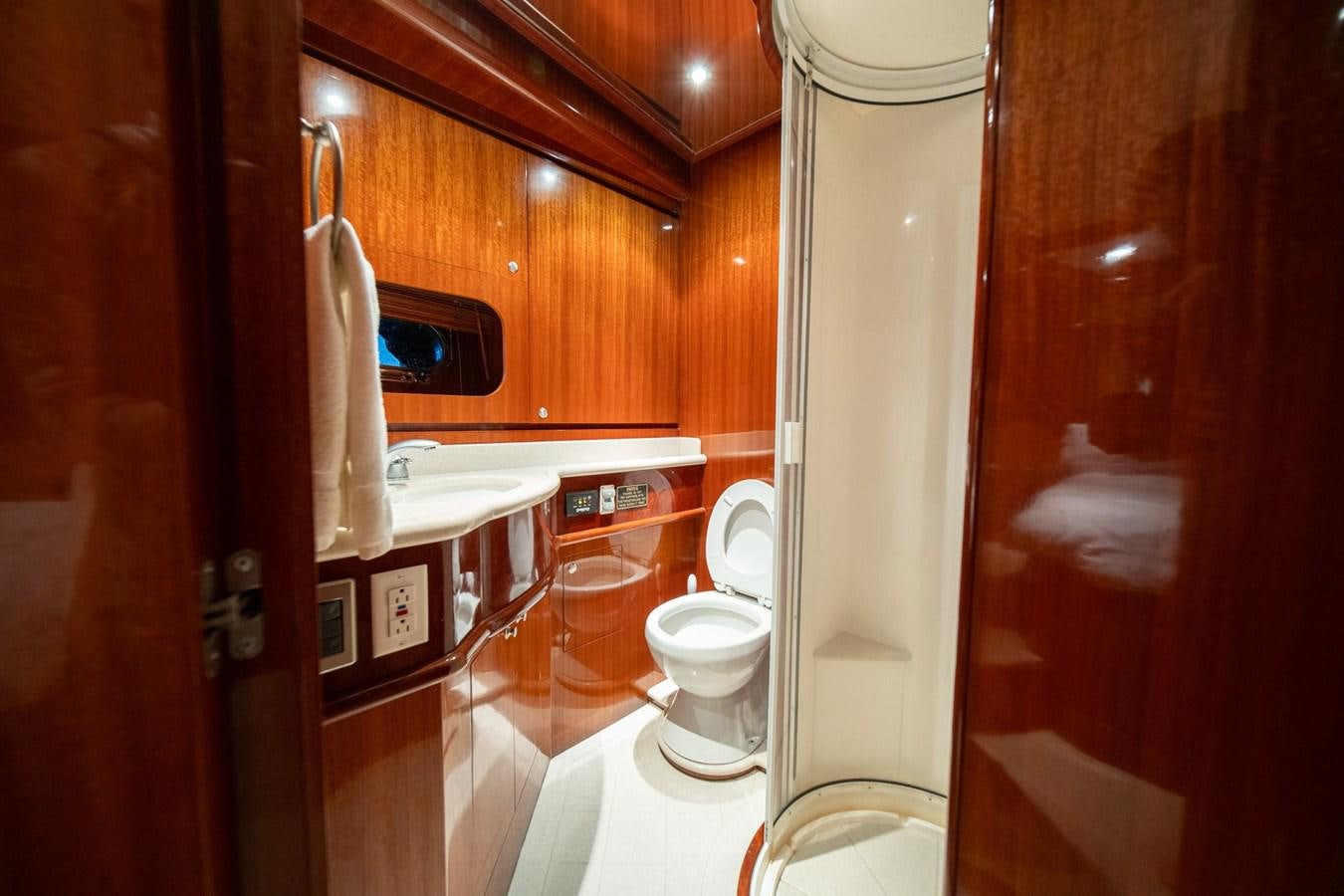 a bathroom with a toilet and sink aboard PRETTY PENNY Yacht for Sale