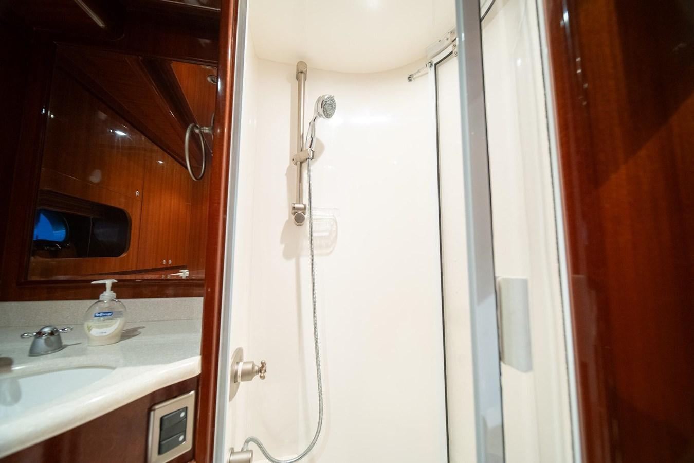 a bathroom with a shower and sink aboard PRETTY PENNY Yacht for Sale