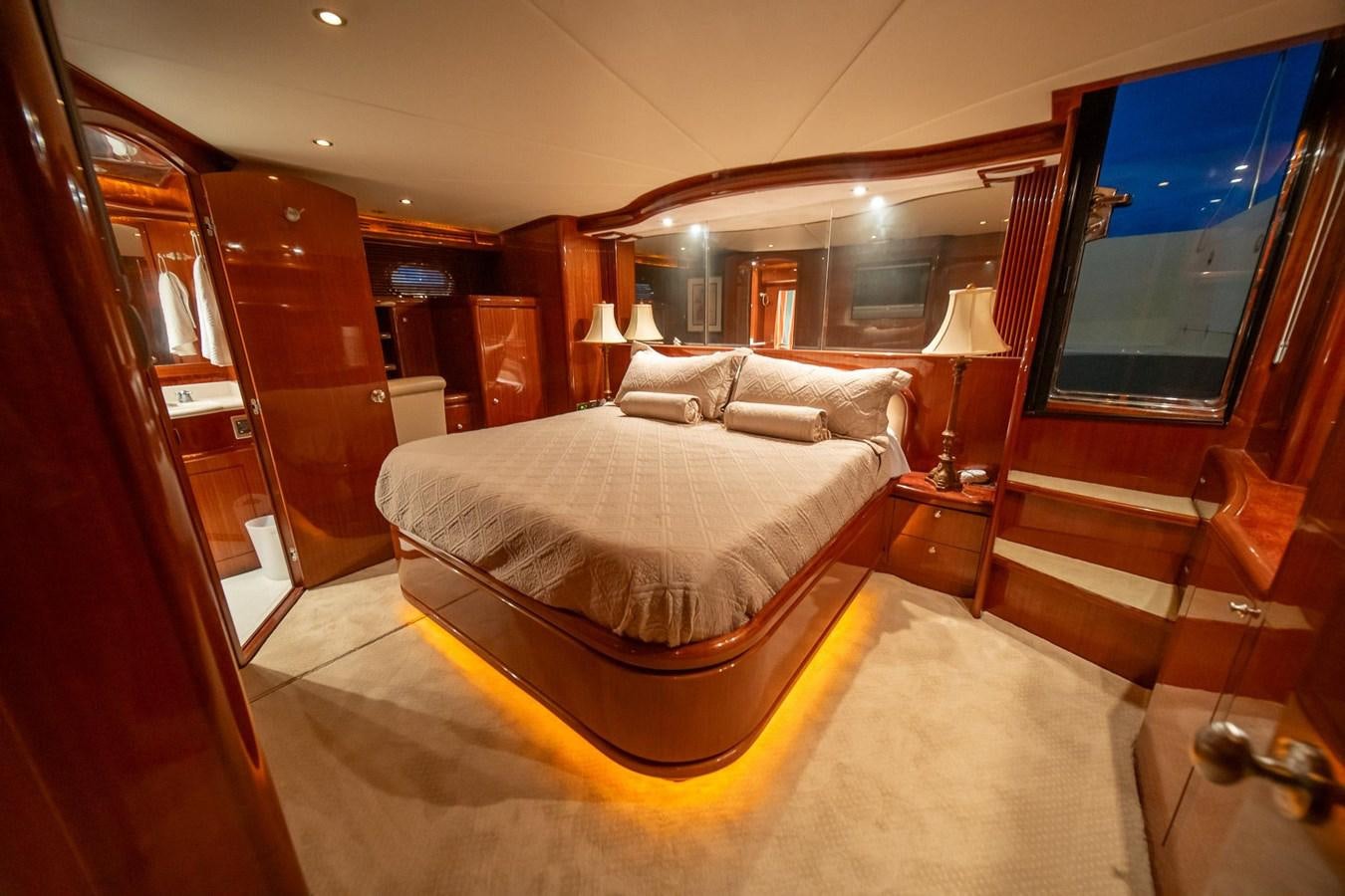 a hotel room with a large bed aboard PRETTY PENNY Yacht for Sale