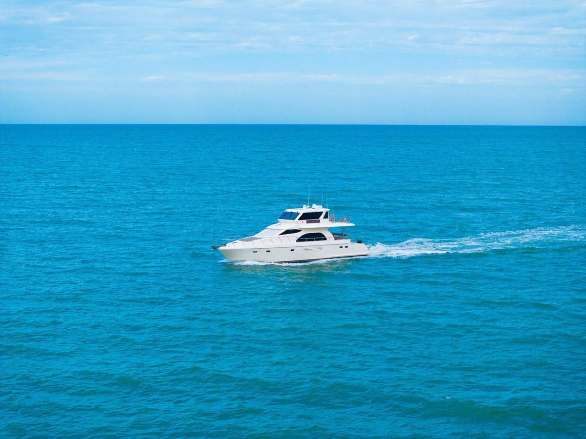 a white boat in the water aboard PRETTY PENNY Yacht for Sale