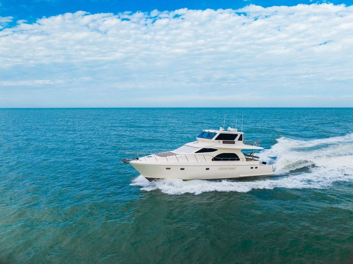 a white boat in the water aboard PRETTY PENNY Yacht for Sale