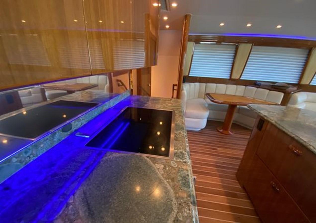a bathroom with a tub sink and a wood cabinet aboard LIKE WHAT U SEA Yacht for Sale