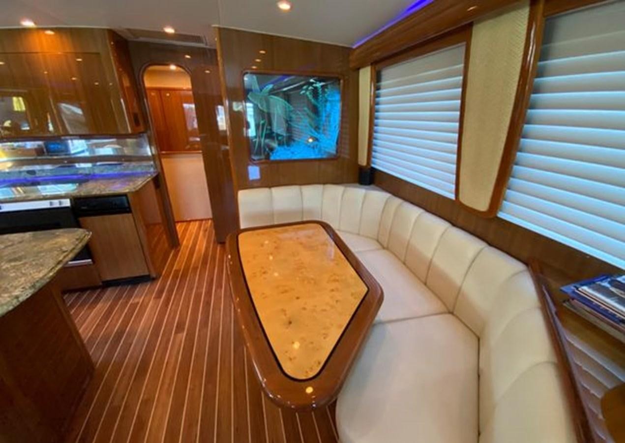 a living room with a couch and a table aboard LIKE WHAT U SEA Yacht for Sale