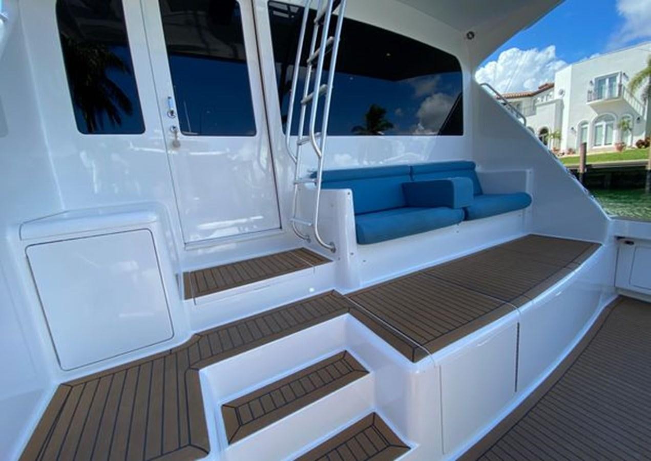a white boat on a deck aboard LIKE WHAT U SEA Yacht for Sale