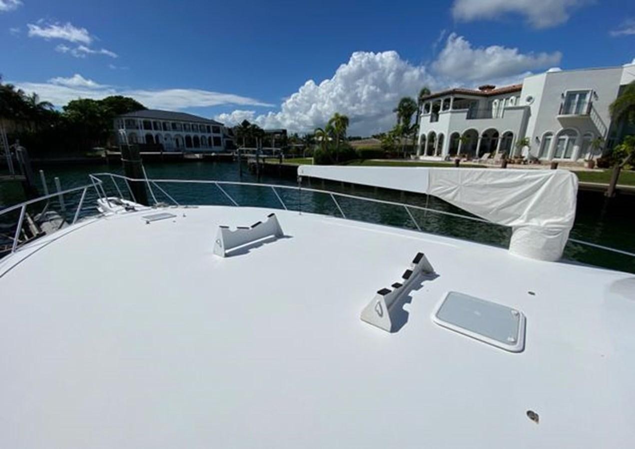 a pool with a water slide and buildings in the background aboard LIKE WHAT U SEA Yacht for Sale