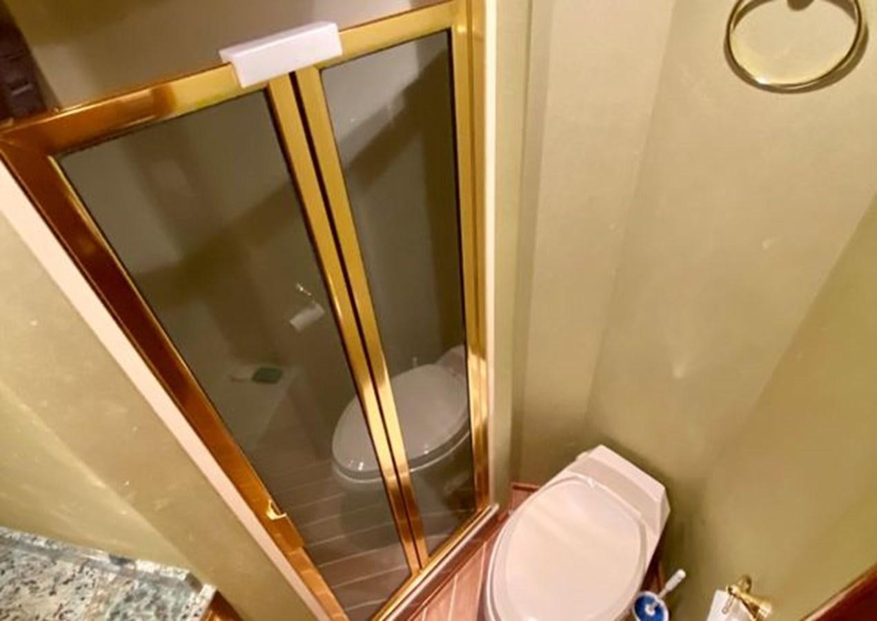 a bathroom with a glass shower aboard LIKE WHAT U SEA Yacht for Sale