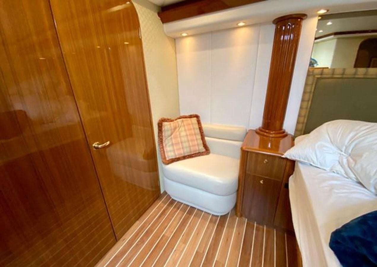a bathroom with a toilet and a mirror aboard LIKE WHAT U SEA Yacht for Sale