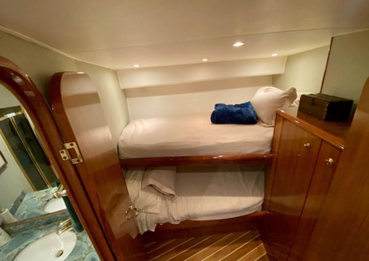 a person lying on a bed aboard LIKE WHAT U SEA Yacht for Sale