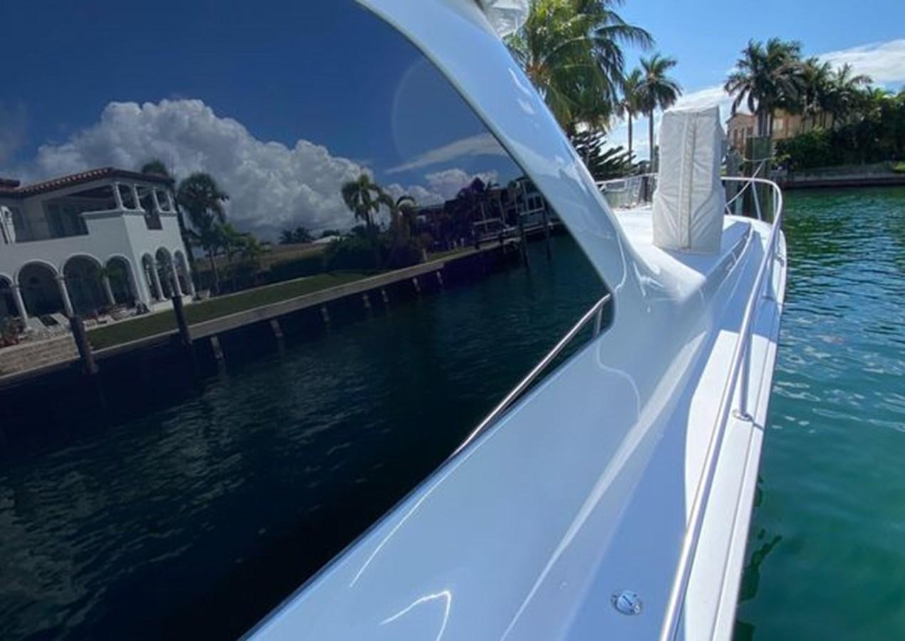 a large pool with a house and trees in the background aboard LIKE WHAT U SEA Yacht for Sale