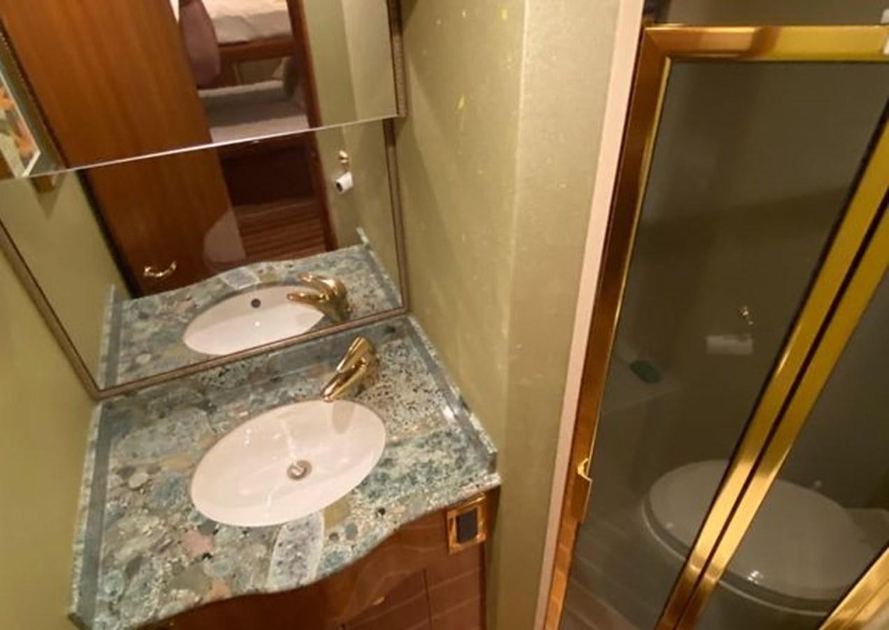 a bathroom with a marble counter top aboard LIKE WHAT U SEA Yacht for Sale