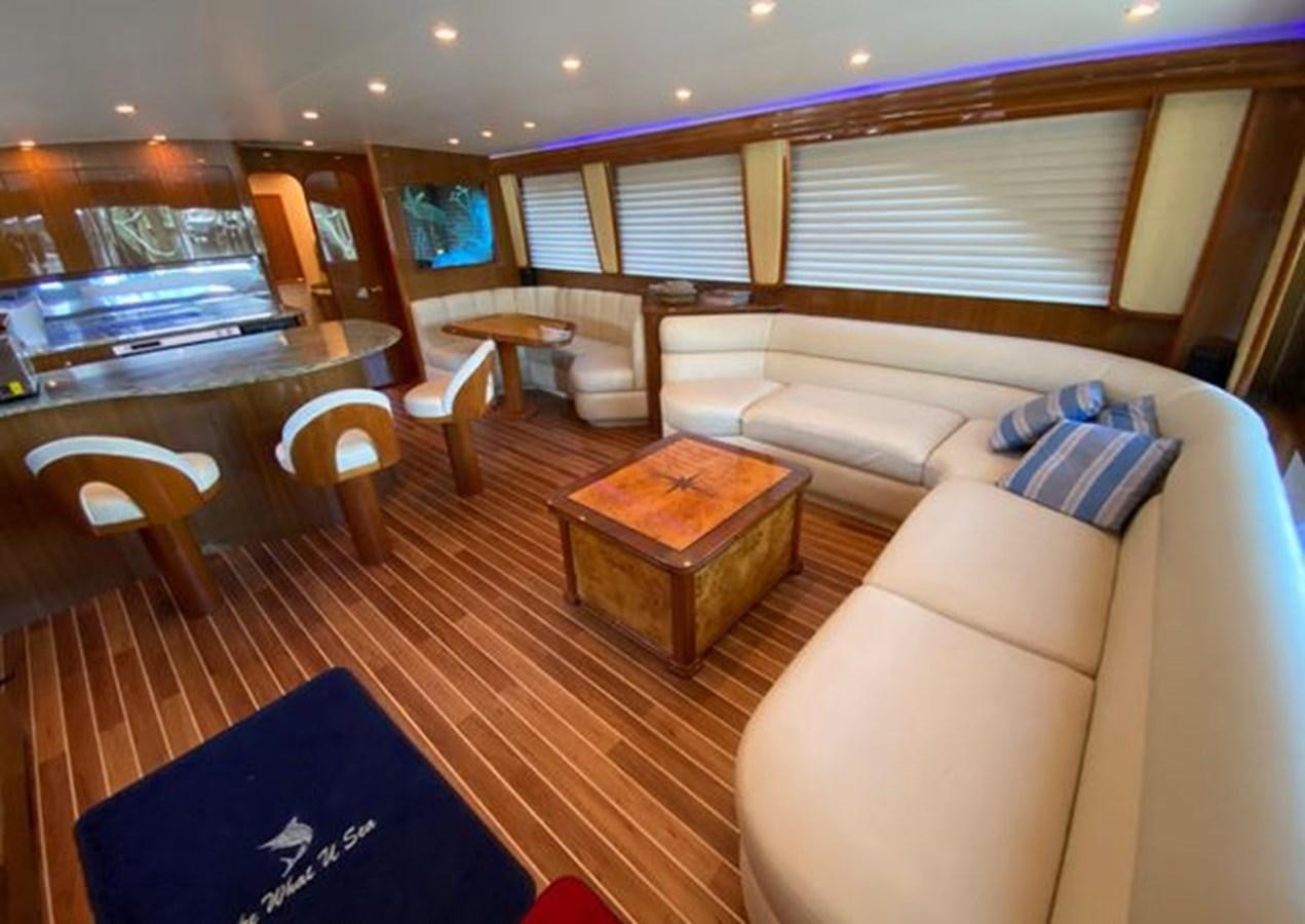 a living room with a couch and a table aboard LIKE WHAT U SEA Yacht for Sale