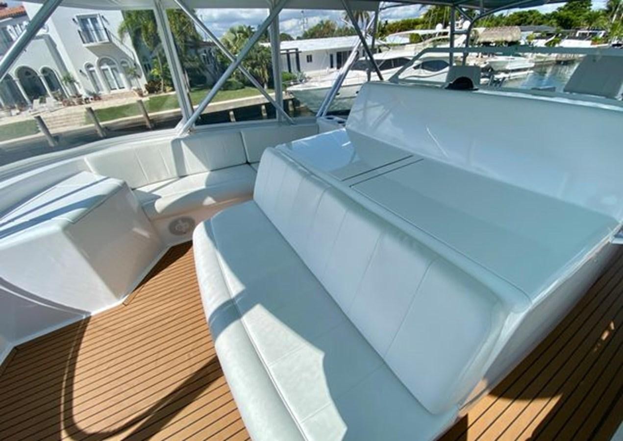 a white car with a large windshield aboard LIKE WHAT U SEA Yacht for Sale