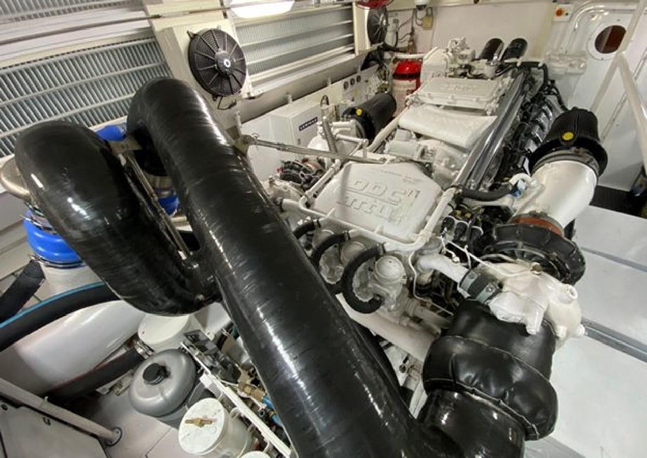 a car engine with a black hood aboard LIKE WHAT U SEA Yacht for Sale