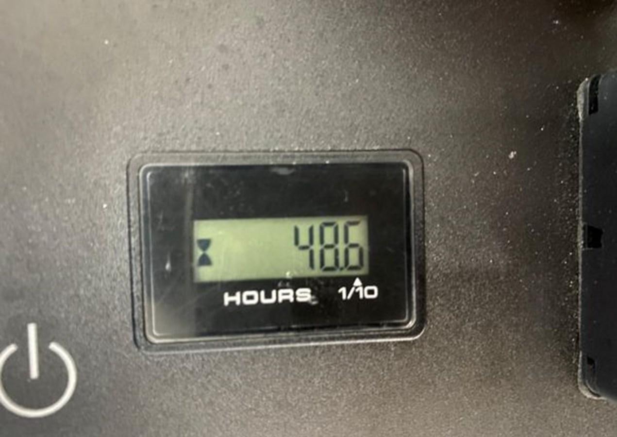 a digital clock on a wall aboard LIKE WHAT U SEA Yacht for Sale