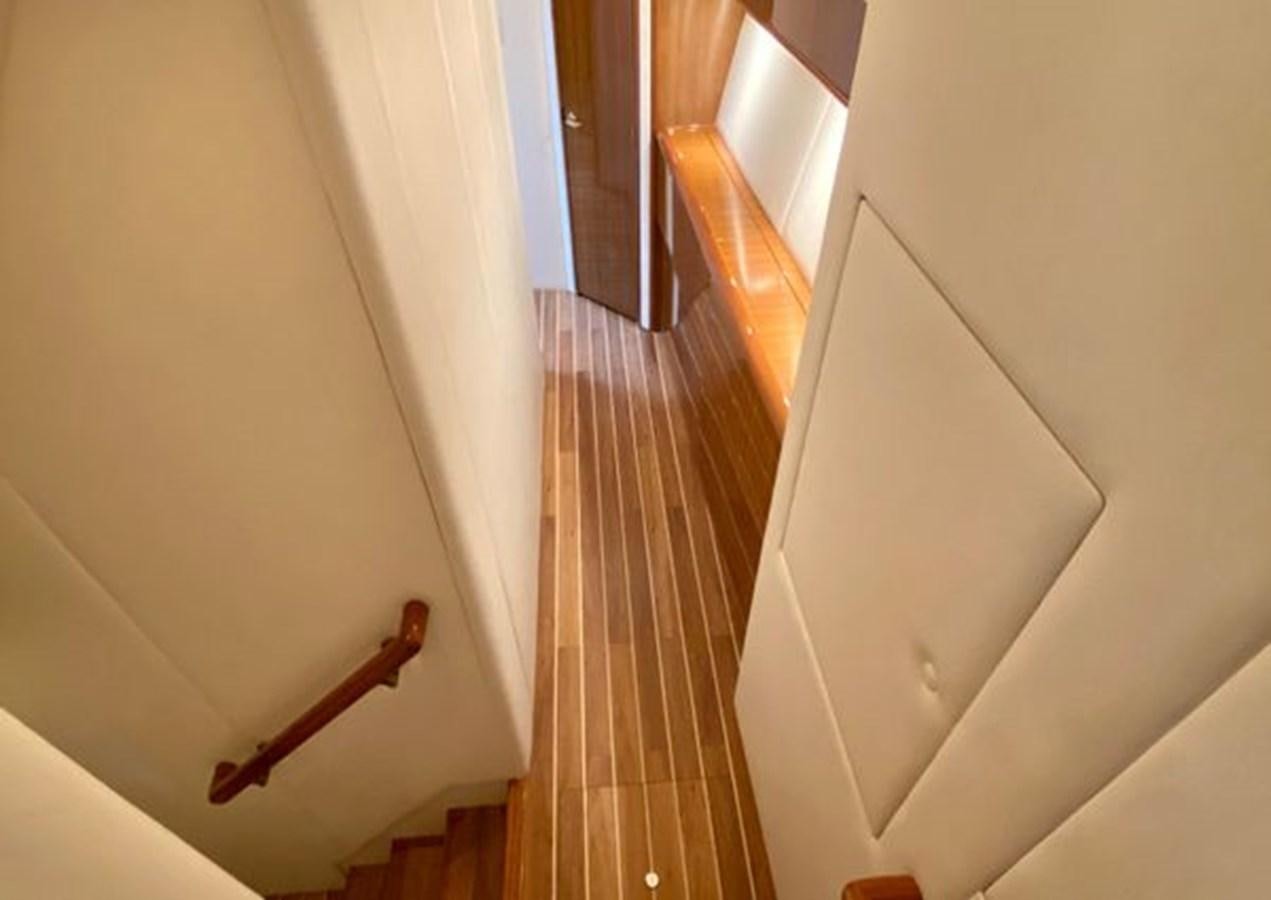 a hallway with a wood door aboard LIKE WHAT U SEA Yacht for Sale
