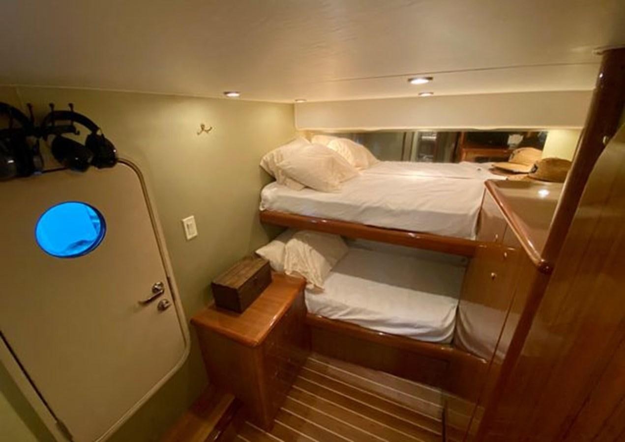 a room with bunk beds aboard LIKE WHAT U SEA Yacht for Sale