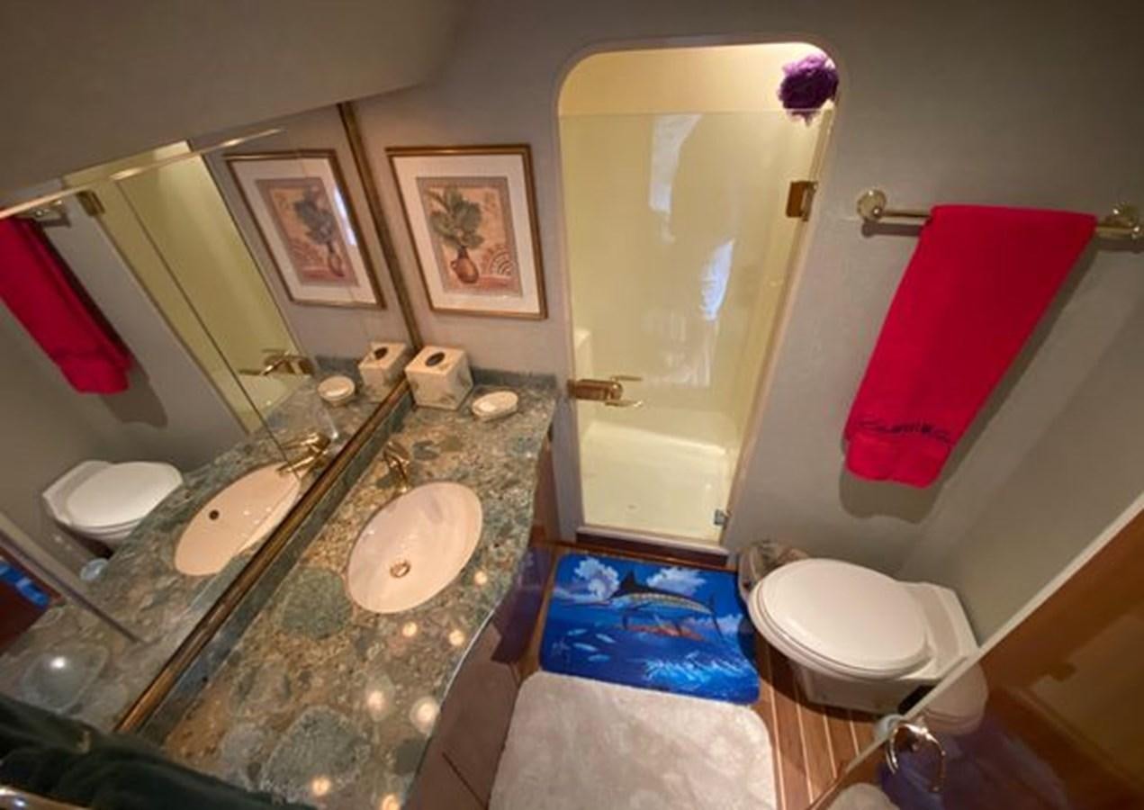 a bathroom with a sink and toilet aboard LIKE WHAT U SEA Yacht for Sale
