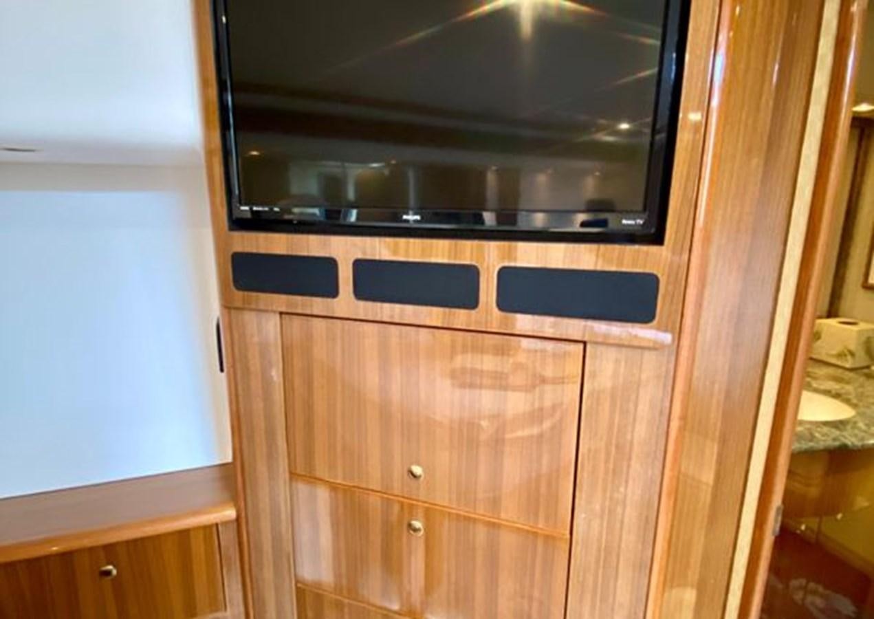 a microwave oven on a wooden cabinet aboard LIKE WHAT U SEA Yacht for Sale