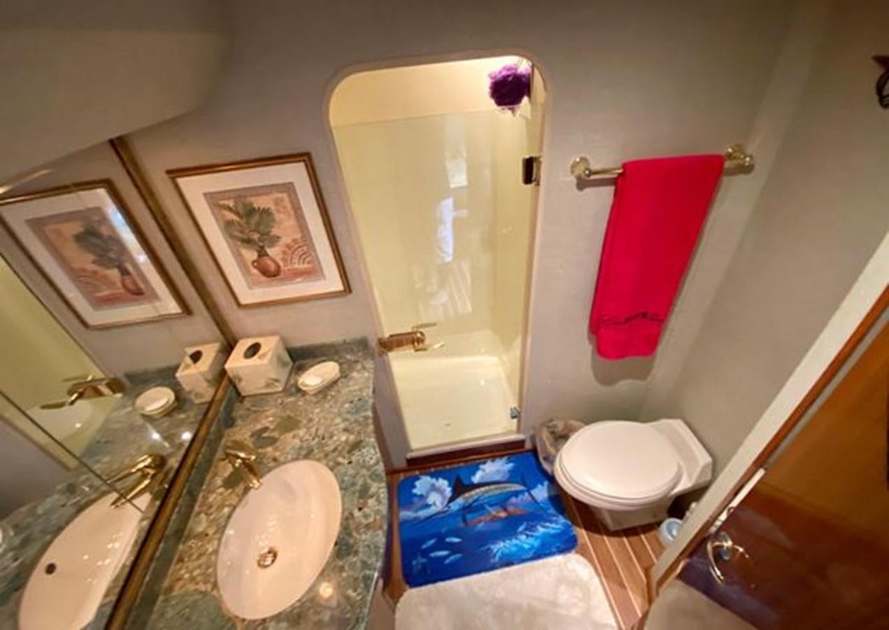 a bathroom with a sink and toilet aboard LIKE WHAT U SEA Yacht for Sale