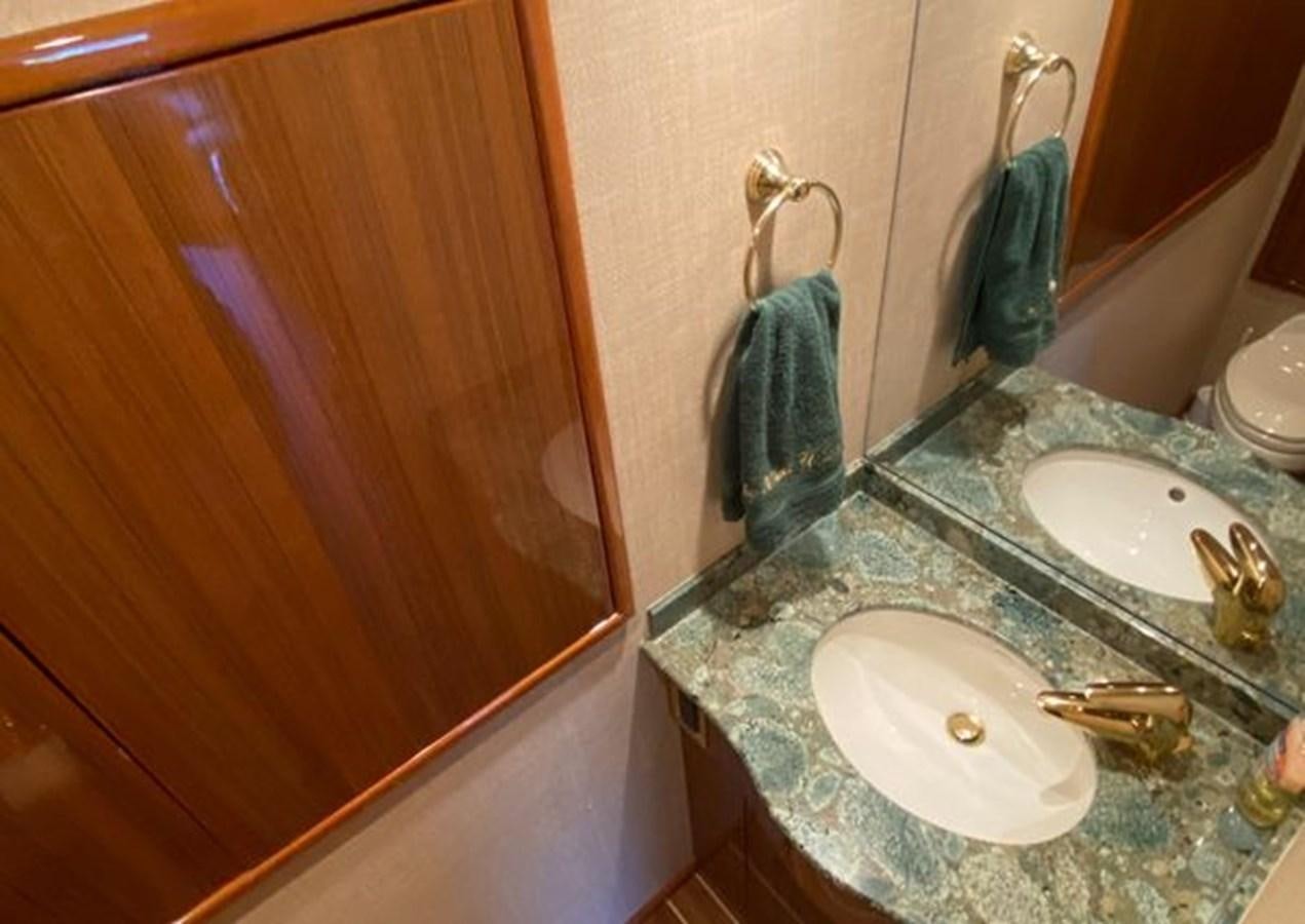 a bathroom with a countertop sink and a mirror aboard LIKE WHAT U SEA Yacht for Sale