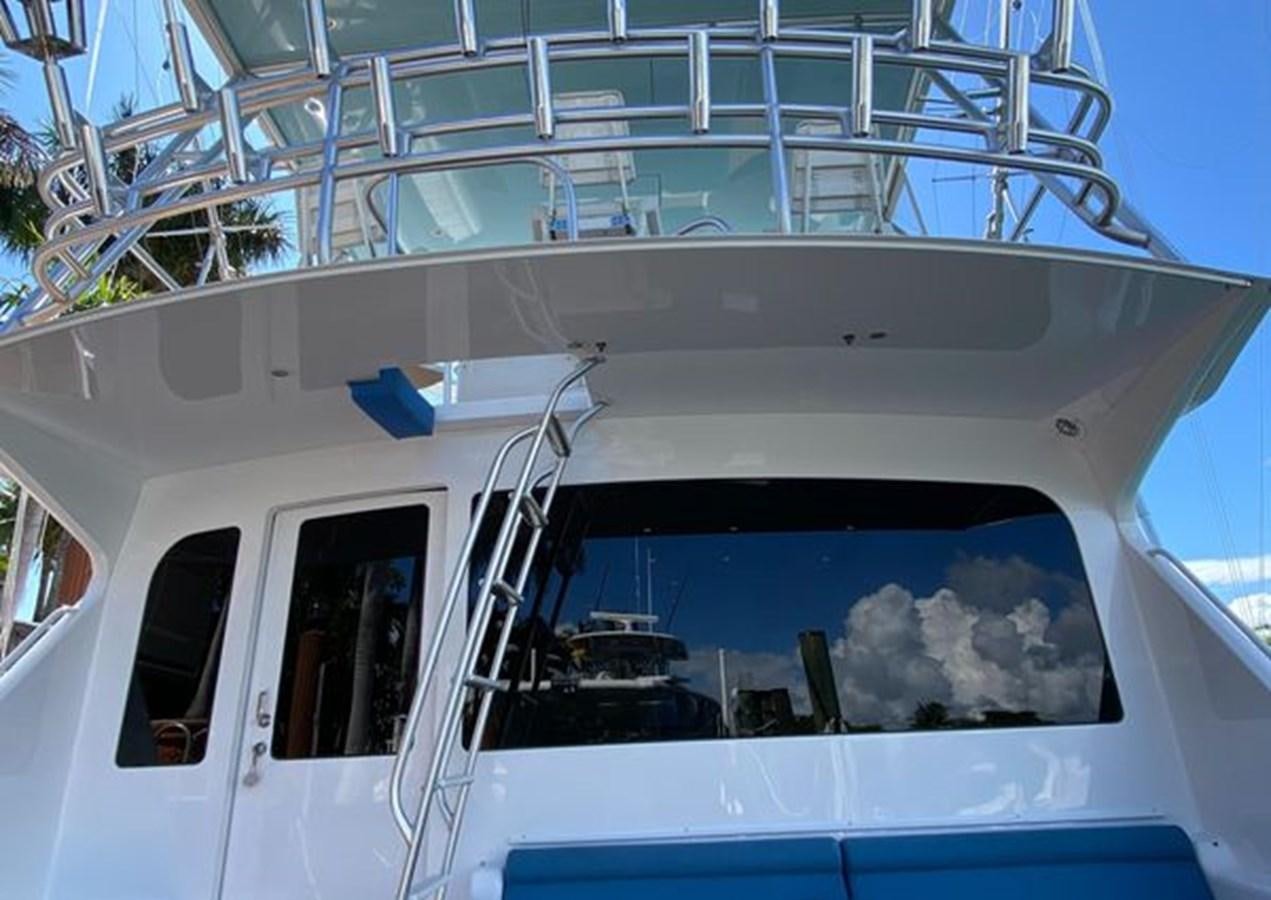 a white building with windows aboard LIKE WHAT U SEA Yacht for Sale
