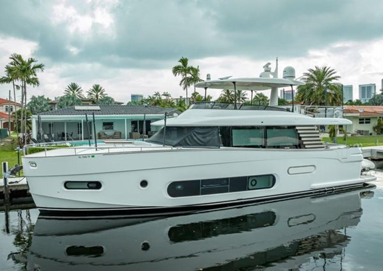 a white boat in a harbor aboard AZIMUT MAGELLANO 30/15 Yacht for Sale