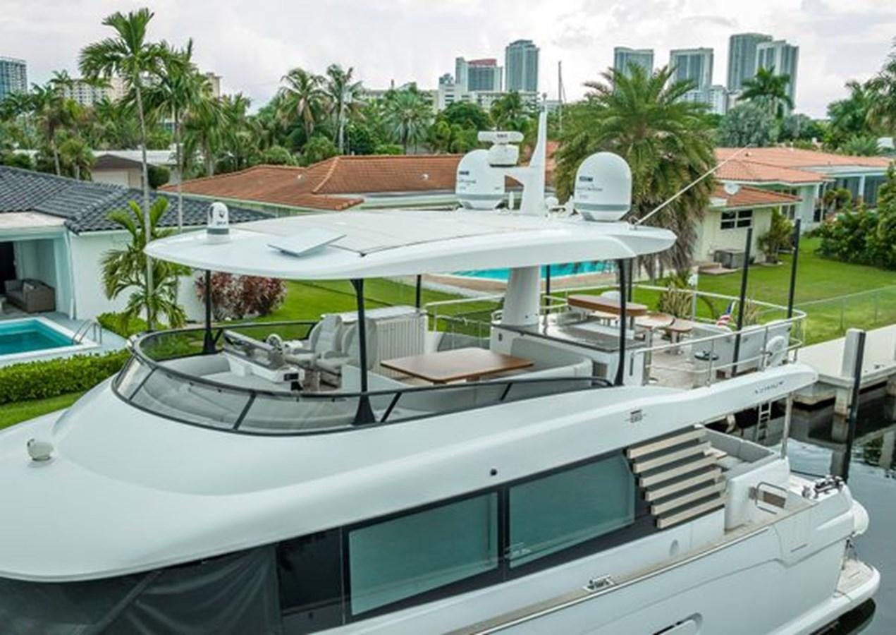 a white boat with a white canopy aboard AZIMUT MAGELLANO 30/15 Yacht for Sale