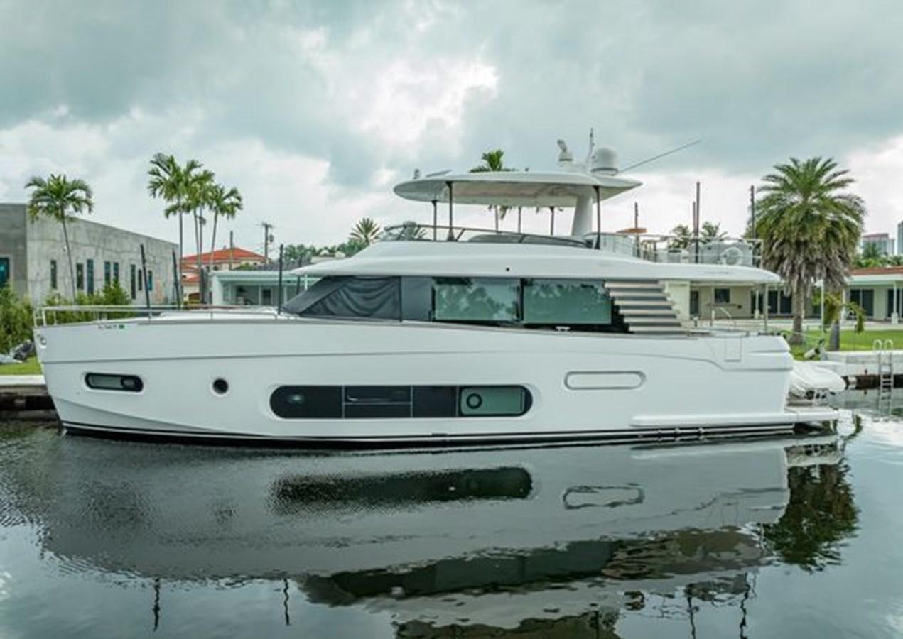 a white yacht in a harbor aboard AZIMUT MAGELLANO 30/15 Yacht for Sale