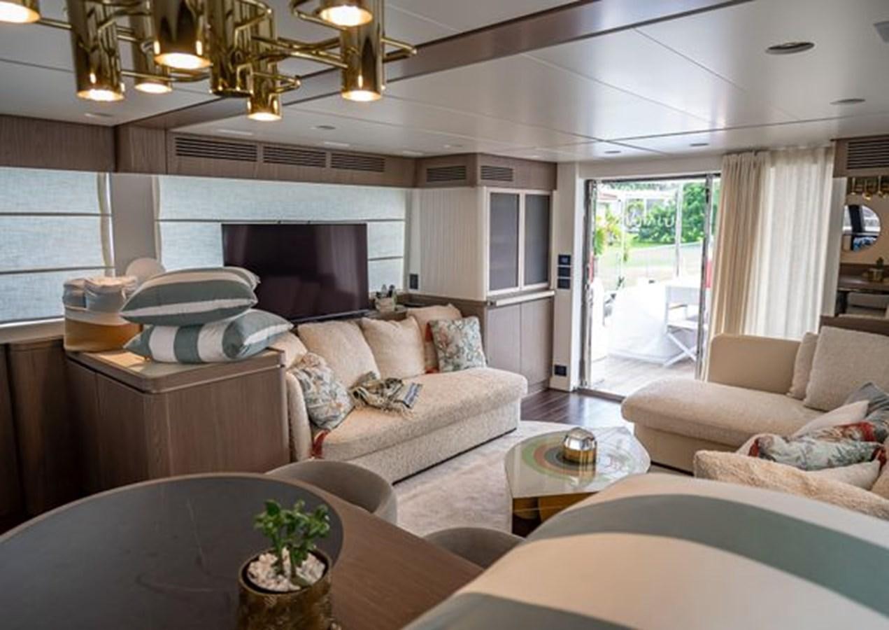 a living room with a couch and a table aboard AZIMUT MAGELLANO 30/15 Yacht for Sale